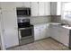 Kitchen features stainless steel appliances and white cabinets at 1330 Bonnie Ln, Charlotte, NC 28213