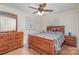 Main bedroom with wood flooring, a dresser, and a large bed at 144 Mcmillian Heights Rd, Iron Station, NC 28080