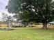 Home features a deck and large backyard with mature trees at 1535 Rolling Meadow Ln, Gastonia, NC 28054