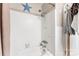 Clean bathroom with shower/tub combo and white tile at 1535 Rolling Meadow Ln, Gastonia, NC 28054