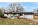 Brick ranch home with gray accents and landscaped yard at 1535 Rolling Meadow Ln, Gastonia, NC 28054