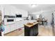 White kitchen with stainless steel appliances and an island at 1535 Rolling Meadow Ln, Gastonia, NC 28054