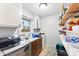 Laundry room with washer, dryer, and ample shelving at 1535 Rolling Meadow Ln, Gastonia, NC 28054