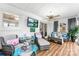 Sunroom with comfortable seating and large TV at 1535 Rolling Meadow Ln, Gastonia, NC 28054