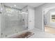 Elegant bathroom with a large walk-in shower and marble tile at 1801 Pin Oak Ct, Fort Mill, SC 29715