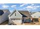 Aerial view of charming house, two-car garage, and neighborhood at 194 Tillery Ln, Mount Gilead, NC 27306