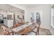 Bright dining room features a wood table and chairs, and access to the kitchen at 194 Tillery Ln, Mount Gilead, NC 27306
