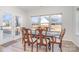 Sunlit dining room with hardwood floors and charming wooden table at 194 Tillery Ln, Mount Gilead, NC 27306