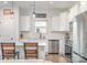 Modern kitchen with stainless steel appliances, white cabinets, and island at 194 Tillery Ln, Mount Gilead, NC 27306