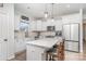 Modern kitchen with island, stainless steel appliances, and white cabinets at 194 Tillery Ln, Mount Gilead, NC 27306