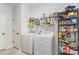 Laundry room with washer, dryer, and ample storage at 194 Tillery Ln, Mount Gilead, NC 27306