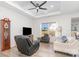 Living room with hardwood floors, comfy seating, and large windows at 194 Tillery Ln, Mount Gilead, NC 27306