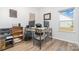 Home office with a corner desk, two computer monitors, and built-in shelving at 194 Tillery Ln, Mount Gilead, NC 27306