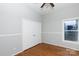 Bedroom with hardwood floors, double door closet and wainscoting at 207 Lee St, Fort Mill, SC 29715
