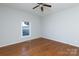 Bright bedroom with hardwood floors and ceiling fan at 207 Lee St, Fort Mill, SC 29715