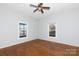 Bedroom with hardwood floors and two windows at 207 Lee St, Fort Mill, SC 29715
