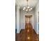 Bright hallway with hardwood floors and chandelier at 207 Lee St, Fort Mill, SC 29715