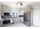 Modern kitchen with stainless steel appliances and gray cabinets at 207 Lee St, Fort Mill, SC 29715