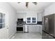 Modern kitchen with stainless steel appliances and gray cabinets at 207 Lee St, Fort Mill, SC 29715