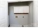 Bright laundry room with upper cabinets at 207 Lee St, Fort Mill, SC 29715