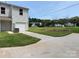 Two-story home with a gray exterior, a garage, and a well-manicured lawn on a sunny day at 2210 Cranberry Way, Salisbury, NC 28147
