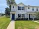 New townhome features a cozy porch and attractive landscaping at 2210 Cranberry Way, Salisbury, NC 28147