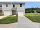 Two-story home with a gray exterior, a garage, and a well-manicured lawn on a sunny day at 2210 Cranberry Way, Salisbury, NC 28147