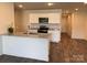 Modern kitchen with stainless steel appliances, granite countertops, and an island at 2210 Cranberry Way, Salisbury, NC 28147