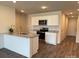 Modern kitchen with stainless steel appliances, granite countertops, and a kitchen island at 2210 Cranberry Way, Salisbury, NC 28147