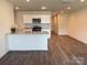 Open-concept kitchen with stainless steel appliances, granite countertops, and ample lighting at 2210 Cranberry Way, Salisbury, NC 28147