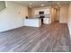 Open concept living area into modern kitchen with grey-toned flooring at 2210 Cranberry Way, Salisbury, NC 28147