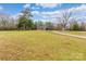 House with large yard, long driveway, and surrounding trees at 2434 Wo Gladden Rd, Chester, SC 29706