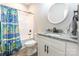 Bathroom with shower/tub, vanity, and patterned curtain at 2434 Wo Gladden Rd, Chester, SC 29706