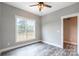 Bedroom with closet, window, and wood-look floors at 2434 Wo Gladden Rd, Chester, SC 29706