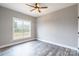Bright bedroom with wood-look floors and ceiling fan at 2434 Wo Gladden Rd, Chester, SC 29706