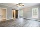 Bedroom with barn door and ceiling fan, hardwood floors at 2434 Wo Gladden Rd, Chester, SC 29706
