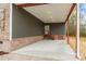 Covered porch with concrete flooring and stairs leading to the house at 2434 Wo Gladden Rd, Chester, SC 29706