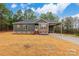 New construction home features gray siding, stone accents, and a covered porch at 2434 Wo Gladden Rd, Chester, SC 29706