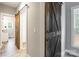 Hallway with barn door leading to laundry and bathroom at 2434 Wo Gladden Rd, Chester, SC 29706