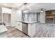 Modern kitchen with white cabinets, granite counters, and island at 2434 Wo Gladden Rd, Chester, SC 29706