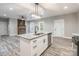 Kitchen island with granite countertop and white cabinets, open to living room at 2434 Wo Gladden Rd, Chester, SC 29706