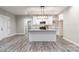 Modern kitchen with white cabinets, granite counters, and island at 2434 Wo Gladden Rd, Chester, SC 29706