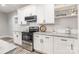 Modern kitchen featuring white cabinets, granite countertops, and stainless steel appliances at 2434 Wo Gladden Rd, Chester, SC 29706