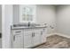 Laundry room with white cabinets and granite countertop at 2434 Wo Gladden Rd, Chester, SC 29706