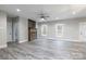 Spacious living room with gray flooring, fireplace, and ceiling fan at 2434 Wo Gladden Rd, Chester, SC 29706