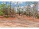 Wooded lot with mature trees and a gently sloping terrain at 2434 Wo Gladden Rd, Chester, SC 29706