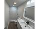 Updated bathroom, featuring a walk-in shower at 3225 Cricketeer Dr, Charlotte, NC 28216