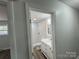 Clean bathroom with white vanity and tiled shower at 3225 Cricketeer Dr, Charlotte, NC 28216