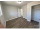 Light-filled bedroom featuring wood-look floors and ample closet space at 3225 Cricketeer Dr, Charlotte, NC 28216