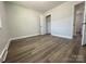Bright bedroom with wood-look floors and spacious closet at 3225 Cricketeer Dr, Charlotte, NC 28216